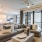 living room with large open spaces and excellent lighting from large window/patio doors