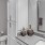 Large bathroom with dual vanities and walk-in closet.