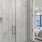 Bedroom ensuite shower with tile background and glass enclosure.
